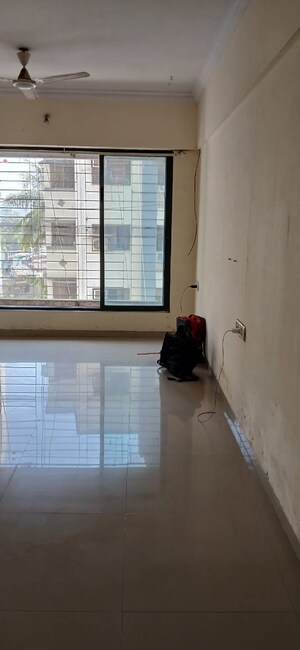 Room in 2 BHK Apartment at Ratna Samuha CHS, Andheri West – for Rent