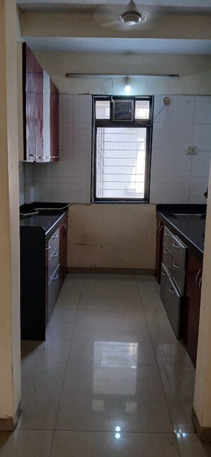 Kitchen in 2 BHK Apartment at Ratna Samuha CHS, Andheri West – for Rent