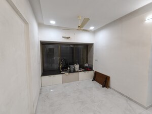 Living Room in 1 BHK Apartment at Siddharth Nagar CHS, Borivali East – for Rent