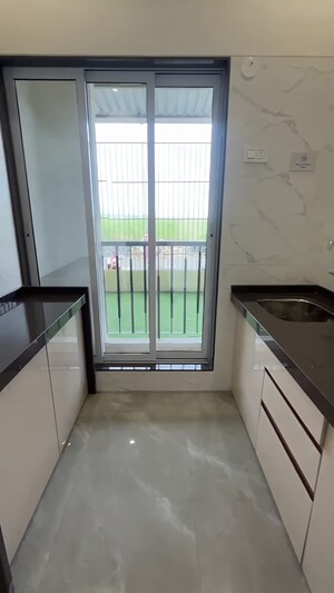 Kitchen in 2 BHK Apartment at Rajlaxmi Nakshatra Auris, Nalasopara West – for Sale