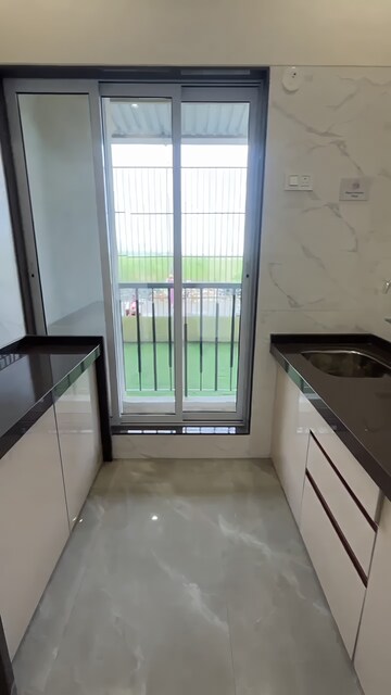 Kitchen in 2 BHK Apartment at Rajlaxmi Nakshatra Auris, Nalasopara West – for Sale