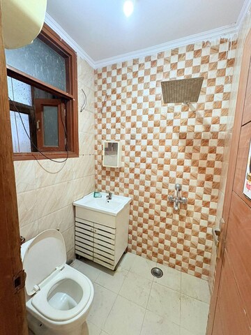 Bathroom in 1 BHK Builder Floor at Chattarpur – for Rent