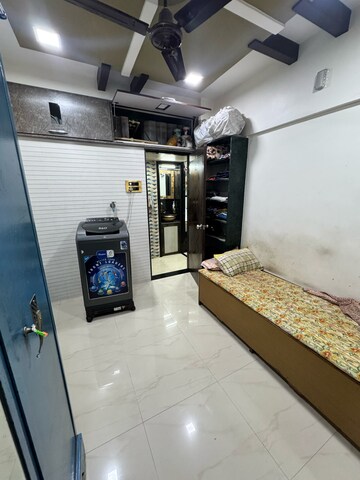 Bedroom in 3 BHK Apartment at Anand Sarita CHS, Sector 7 – for Sale