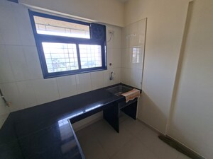 Kitchen in 1 BHK Apartment at Raunak Heights, Ghodbunder Road – for Rent