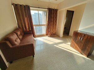 Living Room in 2 BHK Apartment at Omkar Signet, Malad East – for Rent