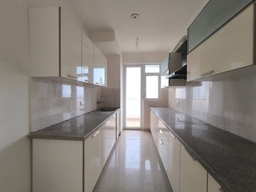 Kitchen in 3.5 BHK Apartment at Emaar Palm Gardens, Sector 83 – for Sale