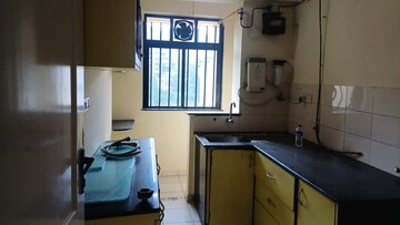 Kitchen in 1 BHK Apartment at Hiranandani Estate Carrara, Ghodbunder Road – for Rent