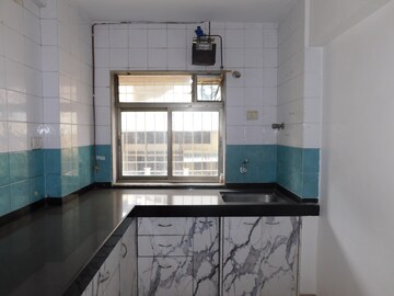 Kitchen in 4 BHK Apartment at Raj Tattva, Kapur Bawdi – for Rent