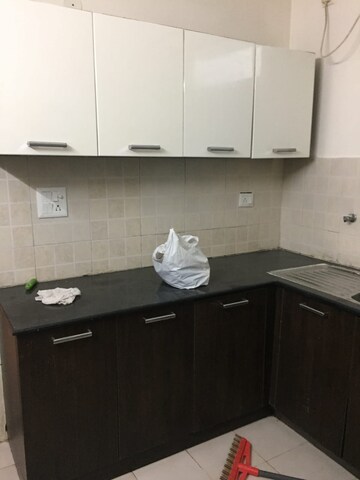 Kitchen in 3.5 BHK Builder Floor at Ansal API Esencia, Sector 67 – for Rent