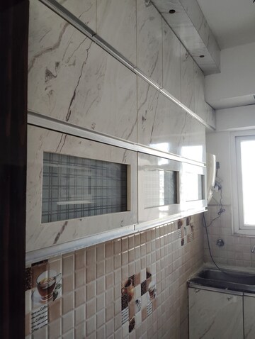 Kitchen in 2 BHK Apartment at Gaur City 2 - 14th Avenue, Sector 16c Greater Noida – for Rent