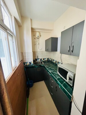 Kitchen in 1 BHK Apartment at Shri Balaji BCC Greens, Deva Road – for Rent