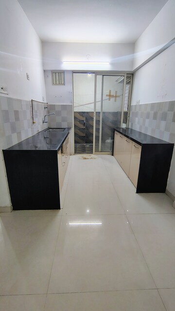 Kitchen in 2 BHK Apartment at Shivam 19 Grand West, Thergaon – for Rent