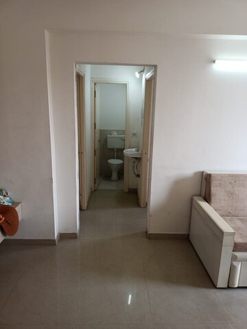 Living Room in 1 BHK Apartment at Applewood Satyesh Residency, Shela – for Rent