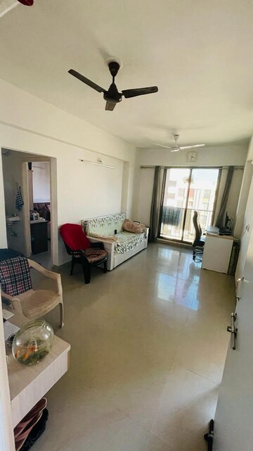 Living Room in 1 BHK Apartment at Applewood Satyesh Residency, Shela – for Rent