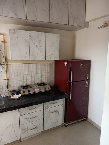 Kitchen in 1 BHK Apartment at Applewood Satyesh Residency, Shela – for Rent
