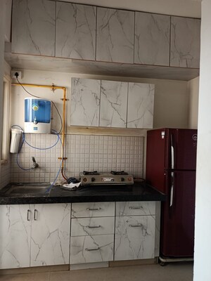 Kitchen in 1 BHK Apartment at Applewood Satyesh Residency, Shela – for Rent