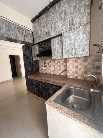 Kitchen in 2 BHK Apartment at Radicon Vedantam, Sector 16c Greater Noida – for Rent