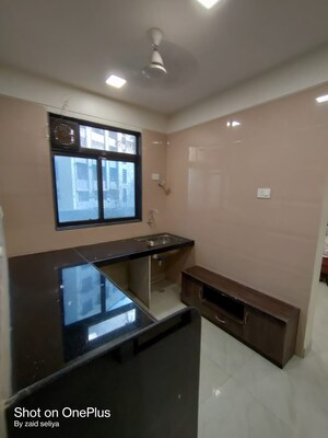 Kitchen in 1 BHK Apartment at Relliance Amann Highland Park, Malad East – for Sale