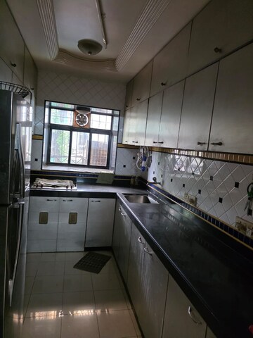 Kitchen in 2 BHK Apartment at Gee Jumbo Darshan, Andheri East – for Rent