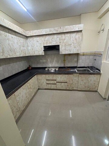 Kitchen in 3 BHK Apartment at Shri Radha Sky Gardens, Sector 16b Greater Noida – for Rent