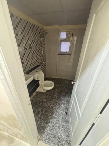 Bathroom in 3 BHK Apartment at Shri Radha Sky Gardens, Sector 16b Greater Noida – for Rent