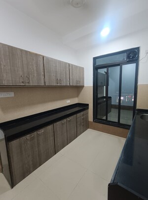 Kitchen in 2 BHK Apartment at Rustomjee Elanza, Malad West – for Rent