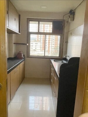 Kitchen in 2 BHK Apartment at Vasant Sagar, Kandivali East – for Sale