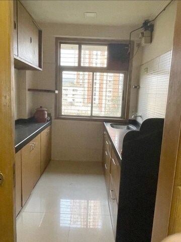 Kitchen in 2 BHK Apartment at Vasant Sagar, Kandivali East – for Sale
