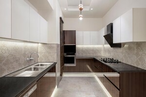 Kitchen in 4 BHK Apartment at Wave City – for Sale