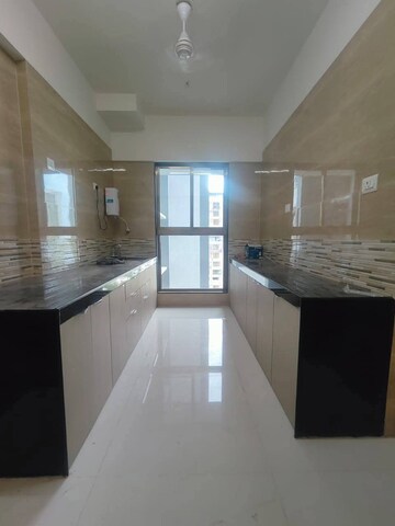 Kitchen in 2 BHK Apartment at Raj Infinia, Malad West – for Rent