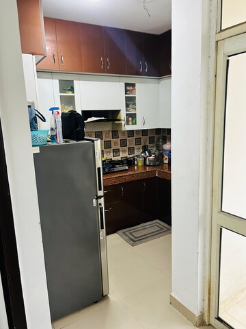 Kitchen in 2 BHK Apartment at Uninav Heights Phase I, Raj Nagar Extension – for Rent