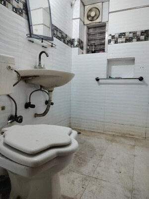 Bathroom in 2 BHK Apartment at RWA Jasola Sector 8 SFS Flat, Jasola – for Sale