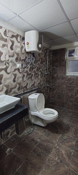 Bathroom in 3 BHK Apartment at Shri Radha Sky Park, Sector 16b Greater Noida – for Rent