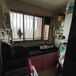 Kitchen in 1 BHK Apartment at Pegasus Tower, Yari Road – for Rent