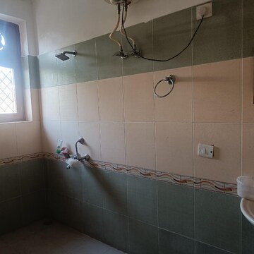 Bathroom in 2 BHK Apartment at Aman Luxury Apartments, Sahastradhara Road – for Rent