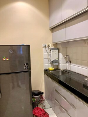 Kitchen in 1 BHK Apartment at Candy Castle, Colaba – for Rent