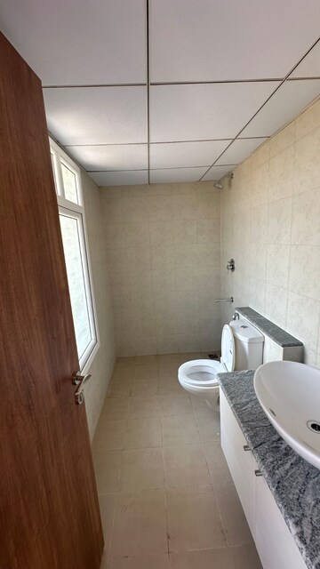 Bathroom in 3 BHK Apartment at Bhartiya City Nikoo Homes 4, Thanisandra Main Road – for Rent