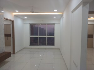 Living Room in 2 BHK Apartment at Godrej Nirvaan, Themghar – for Rent