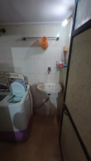 Bathroom in 1 BHK Apartment at Amritvan Complex, Aarey Colony – for Rent