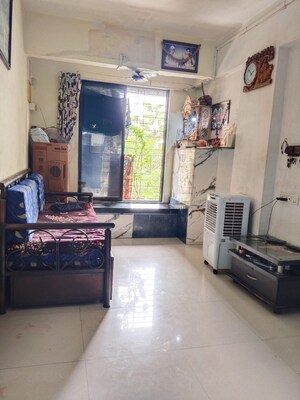 Living Room in 1 BHK Apartment at Kopar Khairane – for Sale