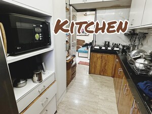 Kitchen in 2 BHK Apartment at Lalani Residency, Kavesar – for Rent