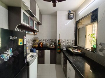 Kitchen in 1 BHK Apartment at Swastik Residency 1, Ghodbunder Road – for Sale