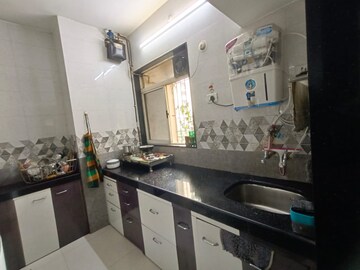 Kitchen in 1 BHK Apartment at Swastik Residency 1, Ghodbunder Road – for Sale