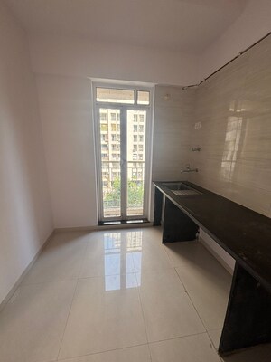 Kitchen in 1 BHK Apartment at Puranik City Phase II, Ghodbunder Road – for Sale