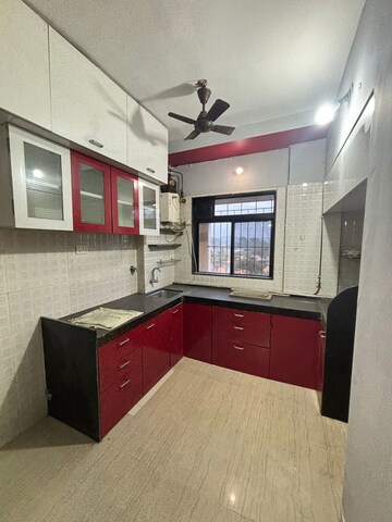 Kitchen in 1 BHK Apartment at Unnati Woods CHS, Kasarvadavali – for Sale