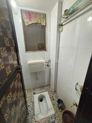 Bathroom in 1 BHK Apartment at Unnati Woods CHS, Kasarvadavali – for Sale