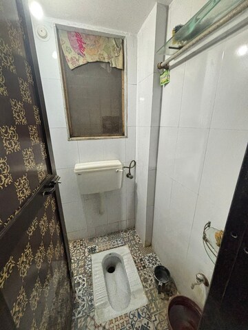 Bathroom in 1 BHK Apartment at Unnati Woods CHS, Kasarvadavali – for Sale