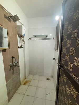 Bathroom in 1 BHK Apartment at Unnati Woods CHS, Kasarvadavali – for Sale