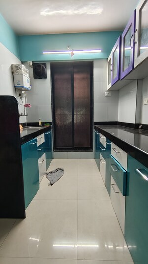 Kitchen in 2 BHK Apartment at Om Sai Agrima Apartment , Mulund East – for Rent