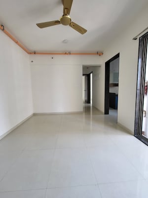 Living Room in 2 BHK Apartment at Runwal Eirene, Balkum Pada – for Rent